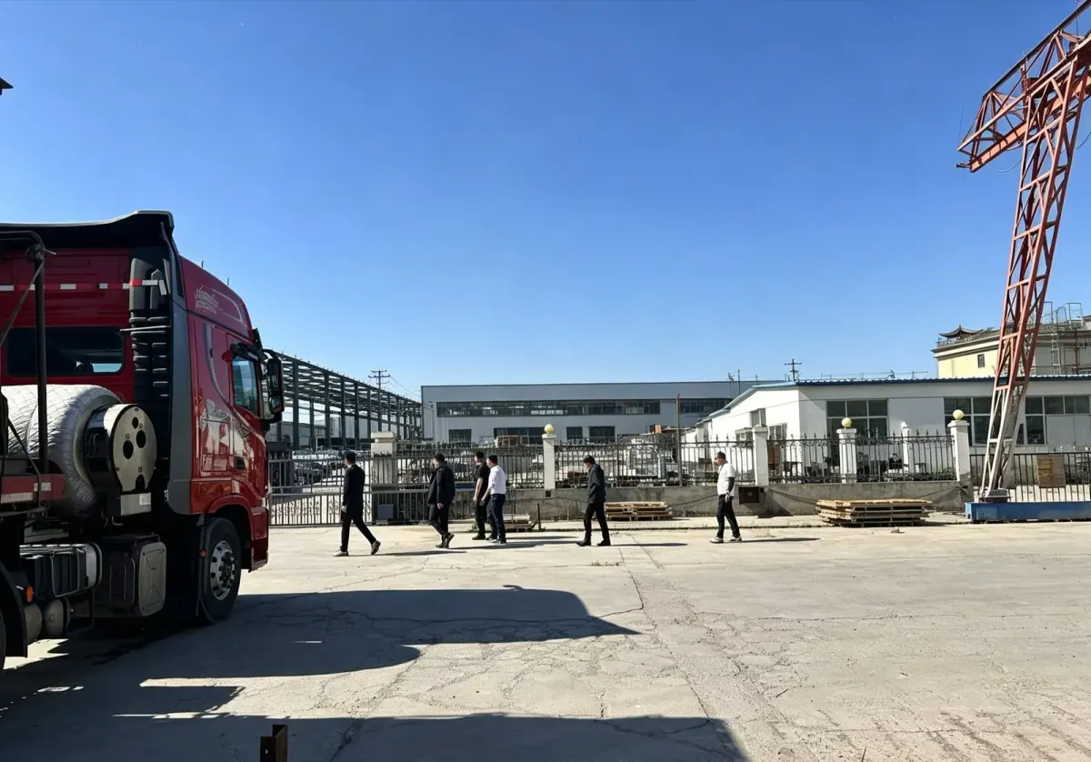 Factory yard with red truck ready for loading